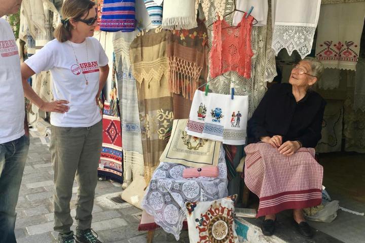 a man and a woman standing in front of a store
