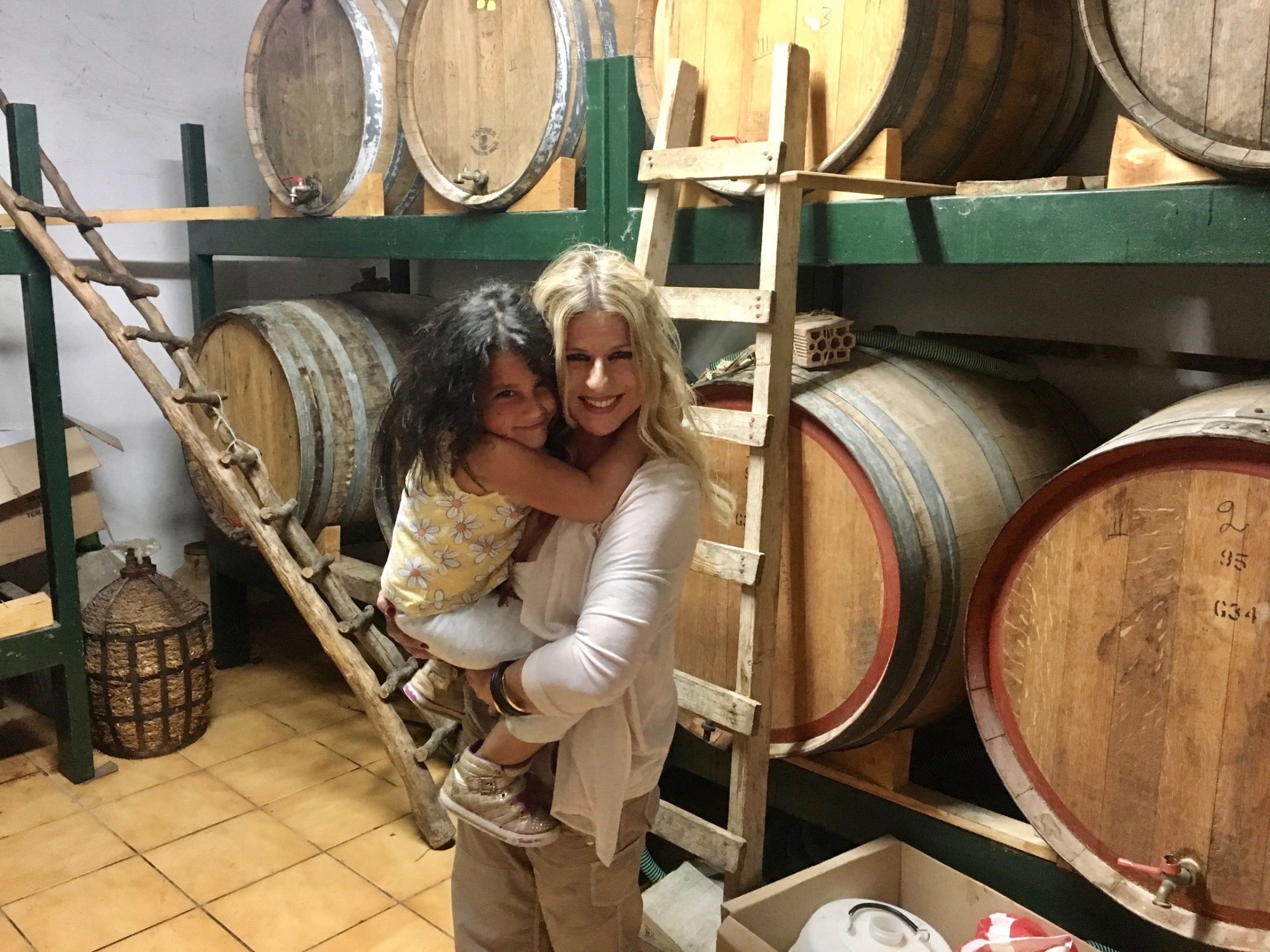 a person standing in front of a barrel