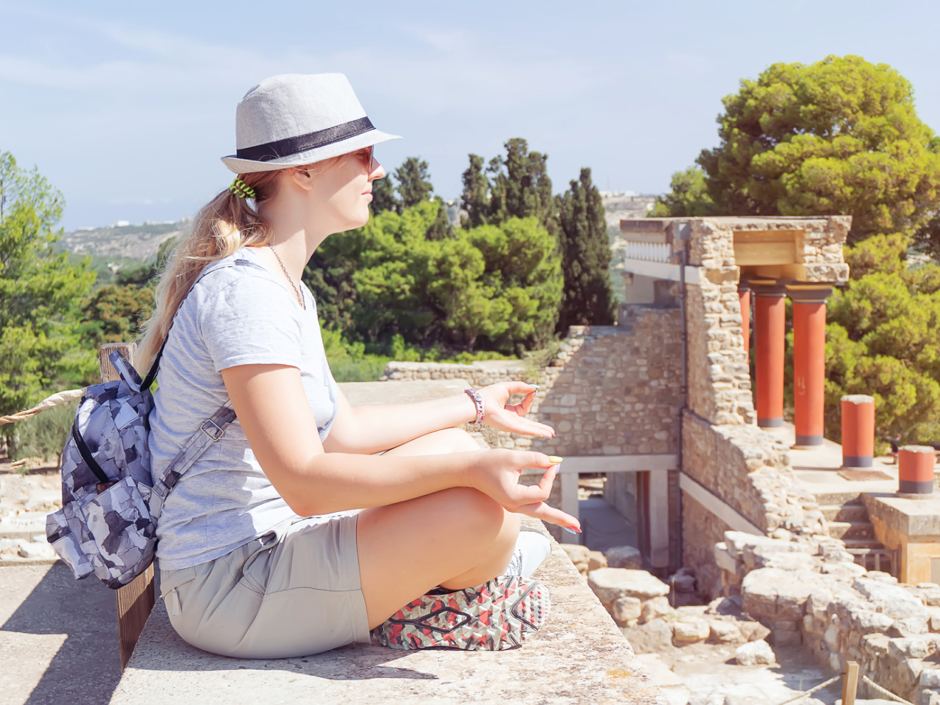 a woman sitting on a bench