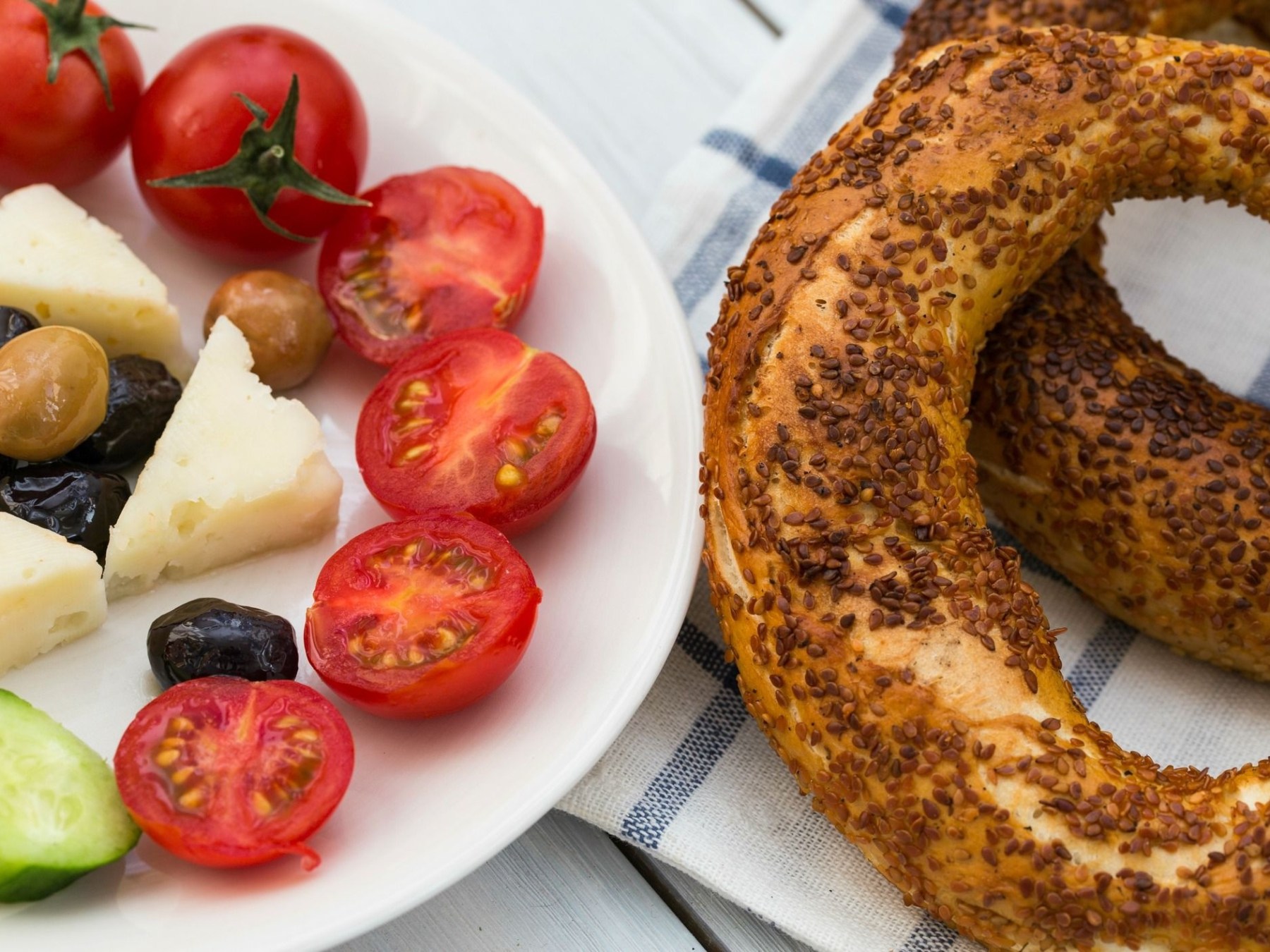 a plate of food with a slice of fresh fruit
